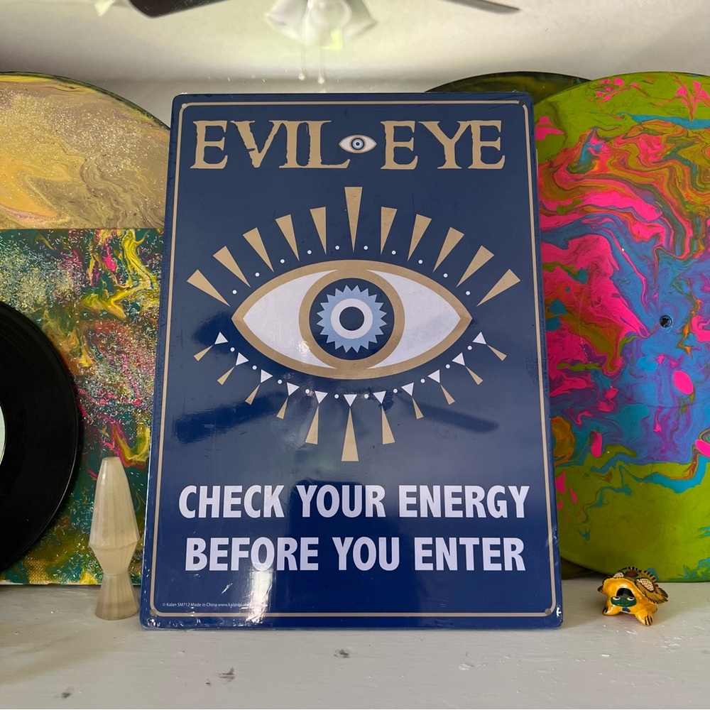 Evil eye sign!